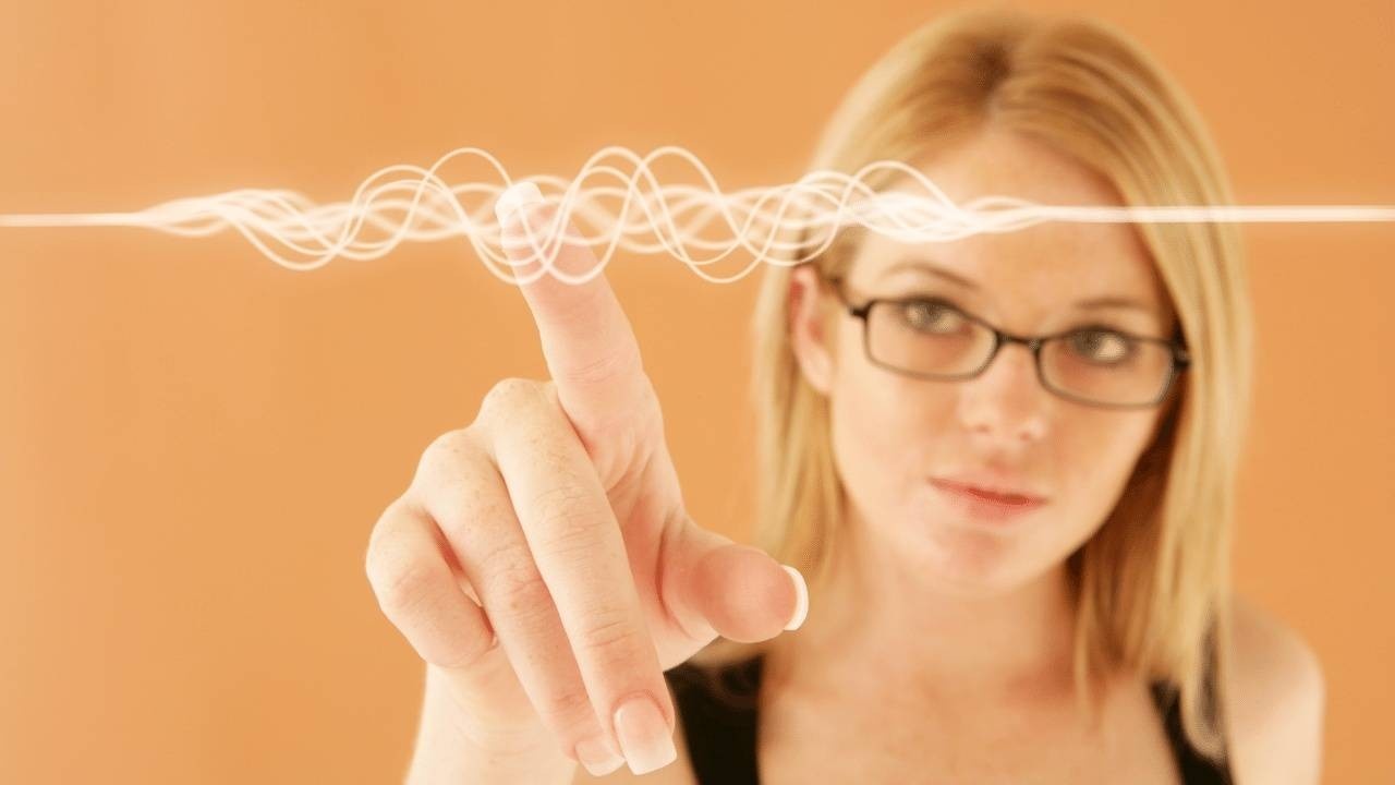 woman pointing at a sound wave