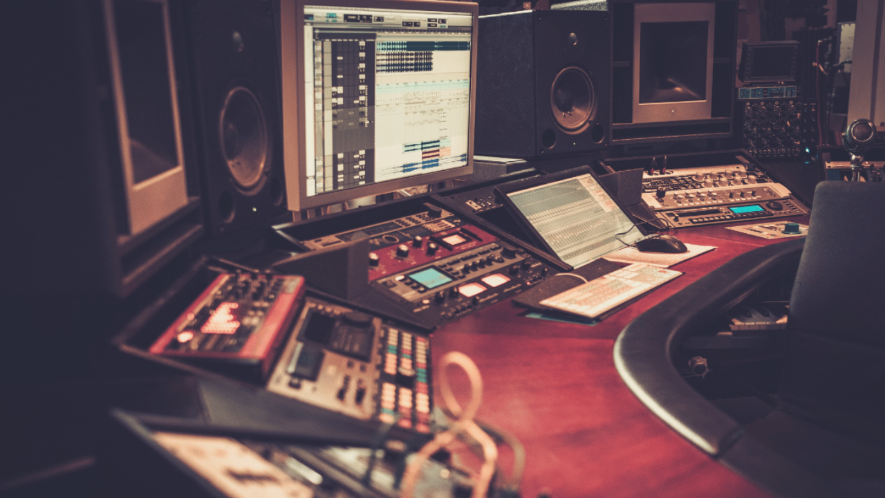 A home studio where a producer mixes their daw tracks in mono for reference