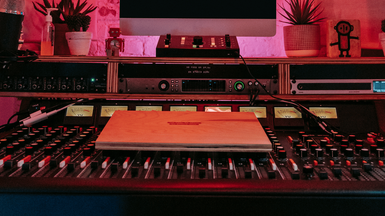 Home recording studio with a mixer and a laptop