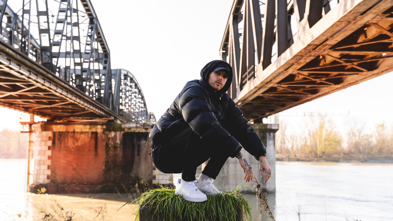 A beatmaker photoshoot by a bridge